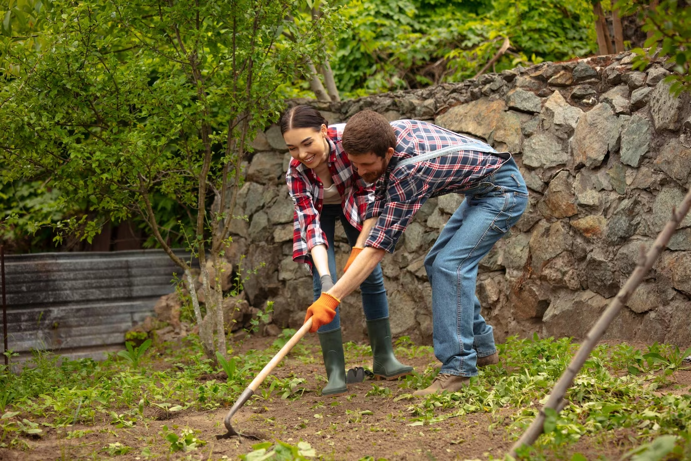 couple working on garden area