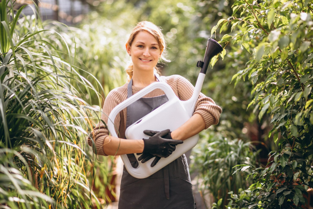 women holding watering pot