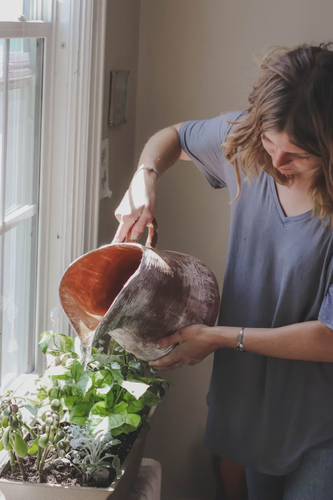 women watering plant