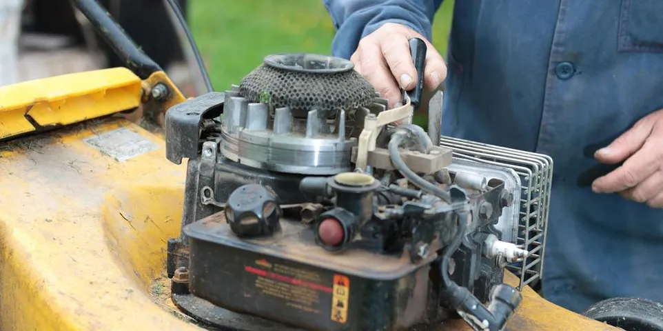 person checking engine for possible fix