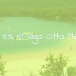 A serene lake with sandy beaches, surrounded by greenery, people enjoying water sports and relaxing in the sun, natural setting, peaceful atmosphere, realistic.