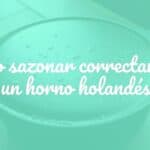 A well-seasoned cast iron Dutch oven sitting on a rustic wooden table, with a thin layer of oil glistening on its surface, showcasing its dark patina, warm lighting, realistic style.