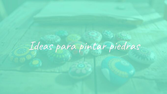 Colorful painted stones with artistic designs, arranged on a wooden table, natural light, creative and relaxing vibe.