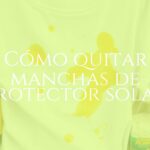 Close-up of a white t-shirt with yellow sunscreen stains, with household cleaning items like vinegar, baking soda, and lemon nearby, bright and clean background, realistic.